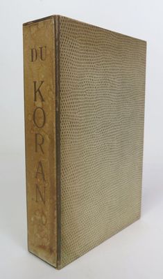 an old book sitting on top of a table next to a white background