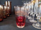 many wine glasses lined up next to each other