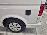 a white van that is parked in a showroom