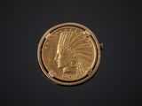 a close up of a gold coin with an indian head on it