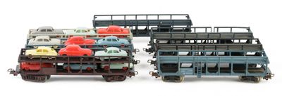 a lot of toy trains that are sitting on a white surface