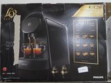 a box with a coffee machine on it on a shelf