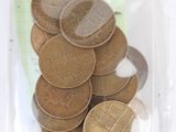 a lot of coins in a bag on the table