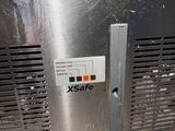 a metal door with a sign on it that says xsafe