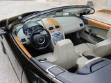 a black car with a tan interior parked in a parking lot