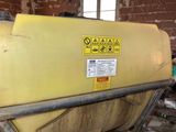 a large yellow tank sitting on top of a table