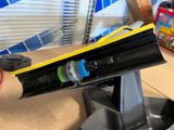 a black object with a yellow strip on top of it