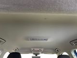 someone is sitting in the back seat of a car with their feet up