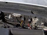 a close up of a car ' s engine with its hood open