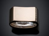 an image of a close up of a ring on a black surface