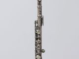 a flute that is sitting on a glass stand