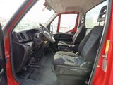 a red truck with black seats in the back of it