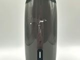 a gray and black soap dispenser on a white background