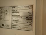 a picture of a sign on the wall of a bathroom