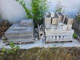 a pile of concrete blocks sitting next to a tree