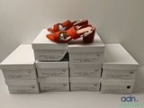several boxes of shoes are stacked on top of each other