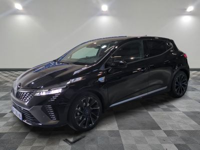 a black car parked in a garage with a checkered floor