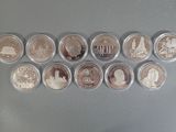 several coins are arranged in a row on a table