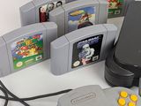 a lot of video game controllers sitting next to each other