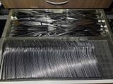 a drawer full of forks and spoons in a kitchen