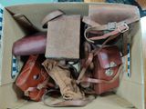 a cardboard box filled with many different types of bags
