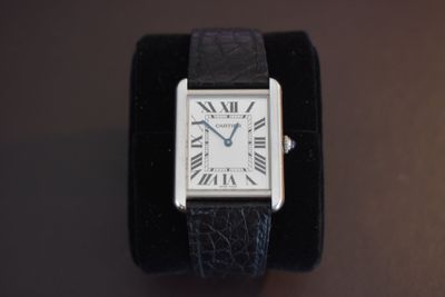 an image of a wrist watch with roman numerals on it