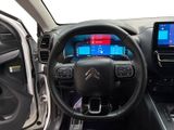 the interior of a car with a steering wheel, dashboard, and a touch screen
