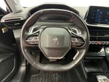 the interior of a car with a steering wheel and dashboard controls