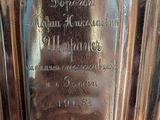 a silver vase sitting on a table in a room