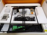 a white box with a bunch of electronics inside of it