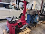 a machine that is sitting on a pallet in a garage