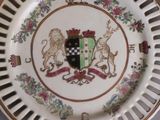 a plate with a coat of arms and a lion on it