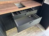 a drawer that is open in the kitchen