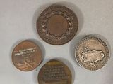 three different coins sitting on top of a table next to each other