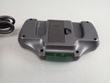 a small device that is sitting on a table next to a charger
