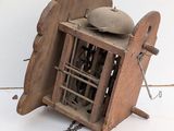 a small wooden object that is chained to a chain