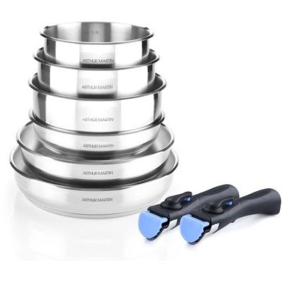 three stainless steel pans and a spatula on a white surface
