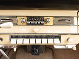 a dashboard of an old car with many buttons on it