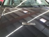 a picture of a car with a sticker on the hood