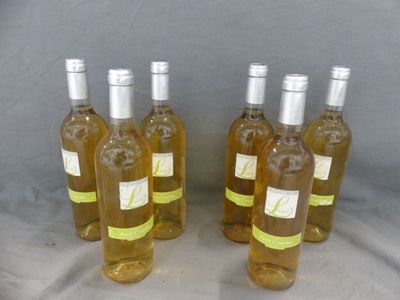 six bottles of wine are lined up on a table