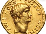 a gold coin with a head of a man on it