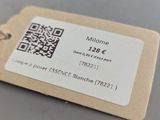 a bottle of wine and a tag on a table
