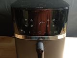 an image of a black and silver blender on a wooden table