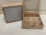 two wooden boxes that are open on the table