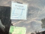 a sticker on the windshield of a car with a sticker on it