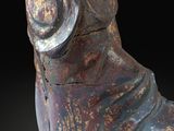 statue of a man with a hat on his head and a hand on his hip