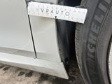 a measuring tape attached to the side of a car