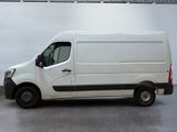 the white van is parked in a large room with a gray floor