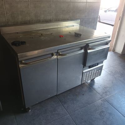 an image of a kitchen with a stainless steel counter top