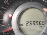 a close up of a digital clock on a car ' s dashboard